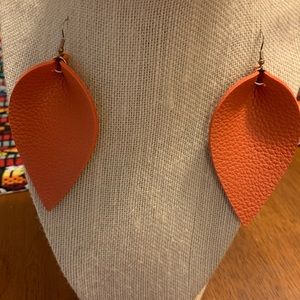 Orange leather fashion earrings.